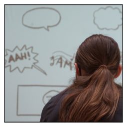 girl in front of comic speech bubbles